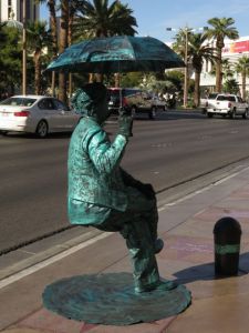 The amazing umbrella sitting man.